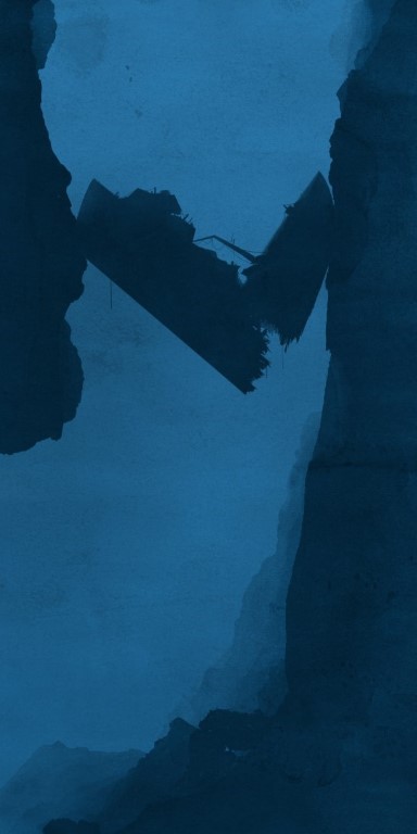 Zerbrochenes Schiffswrack zwischen Felsen